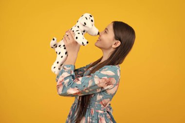 Funny teenage child hold toy. Happy childhood. Kid playing toy. Childcare concept