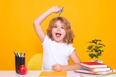 Excited pupil. School child 7-8 years old with book go back to school. Little student