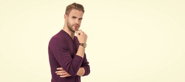 To beard or not to beard. Handsome man touch unshaven chin. Man face portrait, banner with copy space