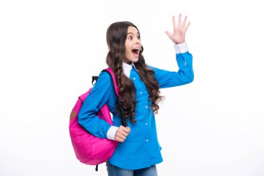 Excited face. Schoolgirl in school uniform with backpack. Teenage girl student on white isolated background. Learning and education children. Amazed expression, cheerful and glad