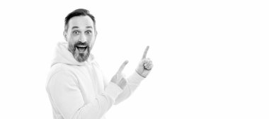 Advertising your brand. adult guy advertising. copy space. mature surprised man pointing finger. Man face portrait, banner with copy space