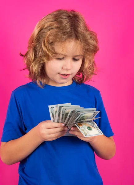 Money bills, salary payment. Studio portrait of child with money banknotes. Kid with money for future. Children learning financial responsibility about saving money