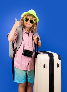 Kid on travel, isolated studio portrait. Child travel and adventure concept