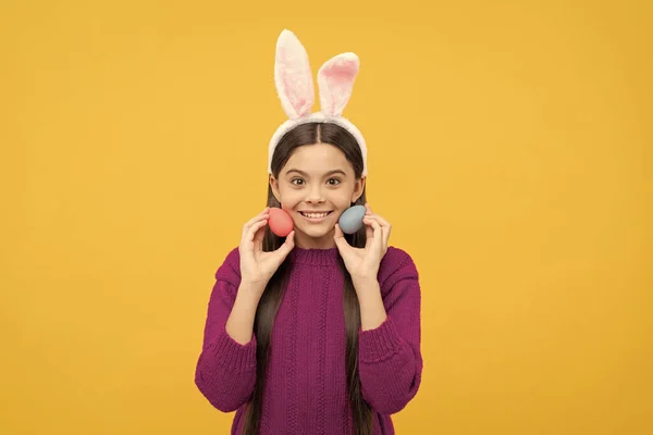 looking for eggs. funny child in hare ears. teenager girl wear rabbit costume. easter bunny hunt. just having fun. ready for party. happy childhood. bunny kid hold painted eggs. happy easter holiday.