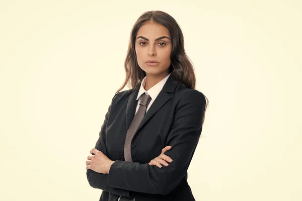 Portrait of business woman in suit crossed arms. Confidence businesswoman against grey background with copy space. Female employee young secretary. Beautiful businesswoman
