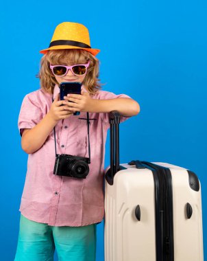 Kid on travel, isolated studio portrait. Child travel and adventure concept