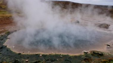 slow motion. Namafjall Hverir geothermal area in Iceland. geothermal iceland geyser. steam comes from geothermal geyser lake in iceland.