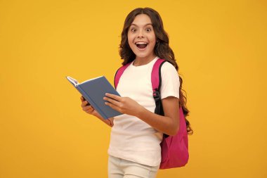 Amazed teen girl. School teenager child girl 12, 13, 14 years old with school bag book and copybook. Teenager schoolgirl student, isolated background. Learning and knowledge. Excited expression.