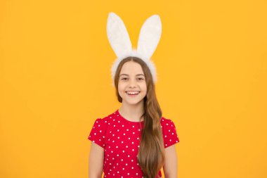 Easter child holidays concept. Happy smiling little teenage girl with bunny ears