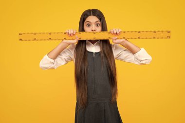 Back to school. Teenager school girl on isolated background. School supplies. Surprised face, surprise emotions of teenager schoolgirl