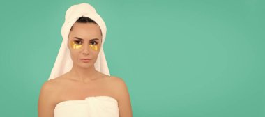 Woman isolated face portrait, banner with copy space. young woman in shower towel with golden patch