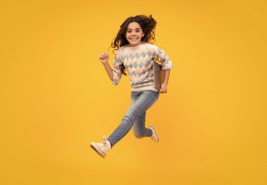 Young student school girl, studying with laptop computer. Run and jump, jumping kids. E-learning concept