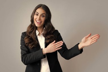 Woman point at copy space, showing copyspace pointing. Promo, girl showing advertisement content gesture, pointing with hand recommend product. Isolated background. Female office worker, success