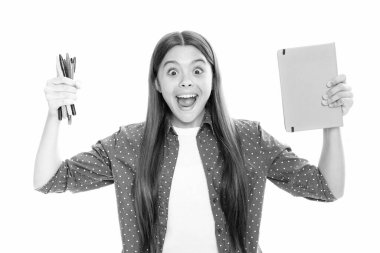 School child with book. Learning and education. Portrait of emotional amazed excited teen schoolgirl