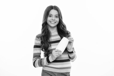 Teenage girl with shampoos conditioners or shower gel. Kids hair care cosmetic product, shampoo bottle. Happy girl face, positive and smiling emotions