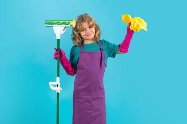 Kid helping with housework, cleaning the house. Cleaning accessory, cleaning supplies. Studio isoalted portrait of child helping with housework, cleaning the house. Housekeeping, home chores