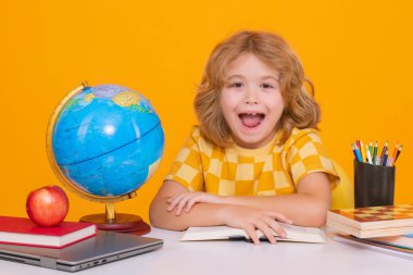 Back to school. Funny little child from elementary school with book. Education. Kid study and learning