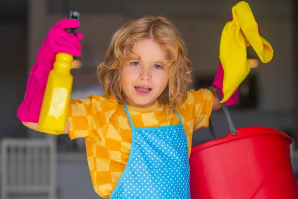 Child mopping house, cleaning home. Detergents and cleaning accessories. Cleaning service. Little boy housekeeping