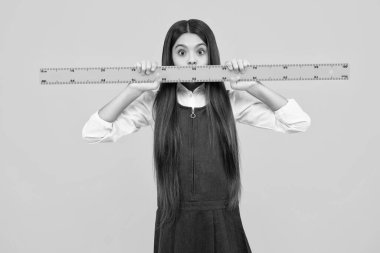 Back to school. Teenager school girl on isolated background. School supplies. Surprised face, surprise emotions of teenager schoolgirl
