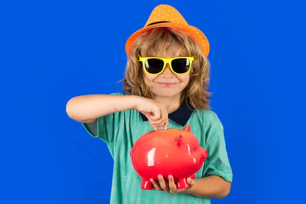 Saving money and piggy bank concept. Kid saving money in a piggy bank, learning about saving, Kid save money in piggybank