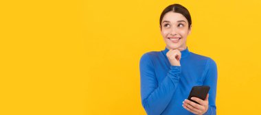 Woman isolated face portrait, banner with copy space. modern communication technology. woman blogger use smartphone. happy lady working online