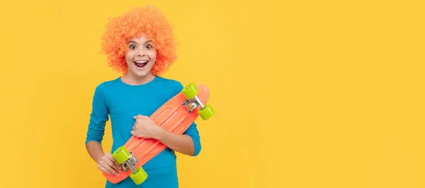 oh my god. fancy party look. kid in clown wig hold penny board. funny child with fancy hair. Funny teenager child on party, poster banner header with copy space