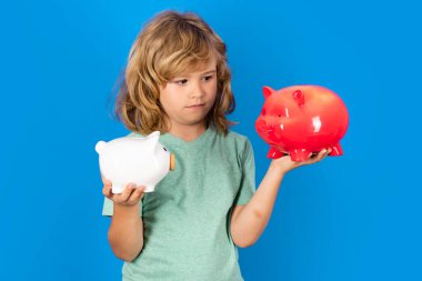 Piggy bank for money. Kid saving money in a piggy bank, learning about saving, Kid save money in piggybank