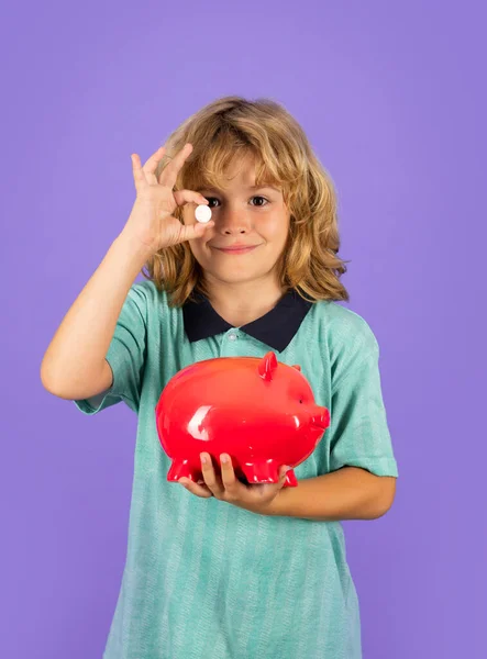 Saving money concept. Child saving money in a piggy bank, learning about saving, Kid save money in piggybank