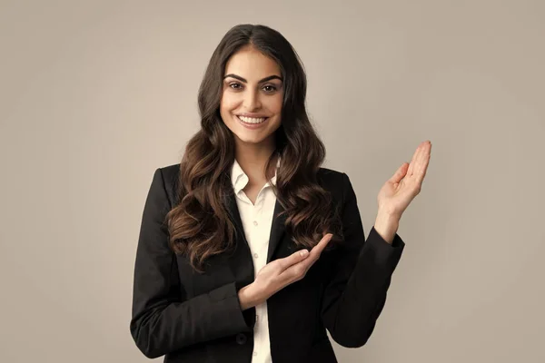Woman point at copy space, showing copyspace pointing. Promo, girl showing advertisement content gesture, pointing with hand recommend product. Isolated background