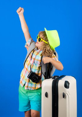 Kid on travel, isolated studio portrait. Child travel and adventure concept