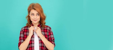 Woman isolated face portrait, banner with mock up copyspace. beauty and fashion. female model in checkered shirt. pretty look of young girl. red haired woman