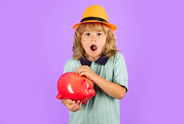 Saving money. Kid saving money in a piggy bank, learning about saving, Kid save money in piggybank