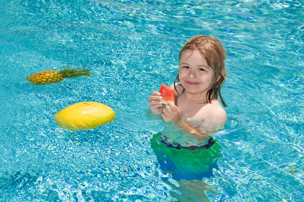 Child in swimming pool. Summer kids activity. Healthy lifestyle