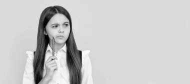 Develop new thinking. Thoughtful girl child yellow background. School education. Keep thinking. Banner of schoolgirl student. School child pupil portrait with copy space