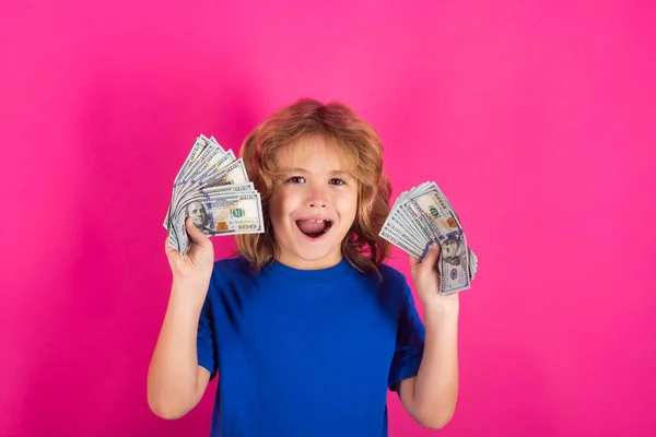 Money win, big luck. Studio portrait of child with money banknotes. Kid with money for future. Children learning financial responsibility about saving money