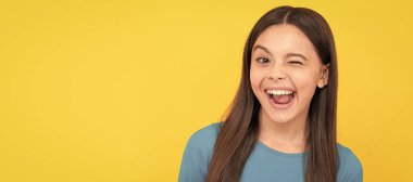 pretty look of young girl. face portrait of child on yellow background. express positive emotions. Child face, horizontal poster, teenager girl isolated portrait, banner with copy space