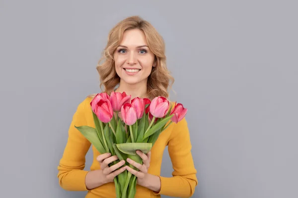 Positive Girl Hold Flowers Spring Holiday Grey Background — Stok fotoğraf