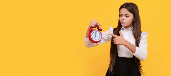 you are late. deadline. early morning. punctuality. last chance. punctual teen girl checking time. Teenager child with clock alarm, horizontal poster. Banner header, copy space