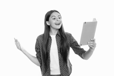 Schoolgirl with copy book posing on isolated background. Literature lesson, grammar school. Intellectual child reader. Portrait of happy smiling teenage child girl