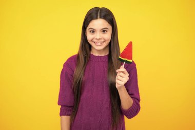 Teenage girl with lollipop, child eating sugar lollipops, kids sweets candy shop