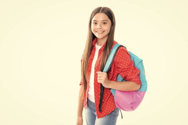 Back to school. Teenager schoolgirl in school uniform with bagpack. School children on isolated studio white background. Portrait of happy smiling teenage child girl