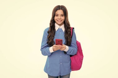 Teen student girl hold backpack use mobile cell phone on white background. Education in college