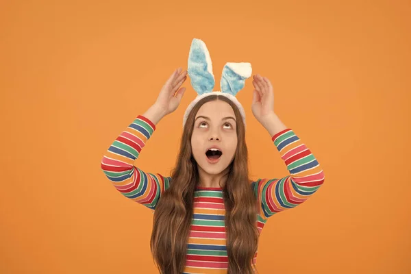 oh mu god. happy easter. childhood happiness. child in rabbit costume. time for fun. adorable kid wearing funny hare ears. easter spring holiday. surprised teen girl wear bunny ears.
