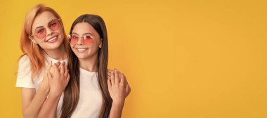 Mother and daughter child banner, copy space, isolated background. happy family portrait of loving mom and child girl in glasses, family love