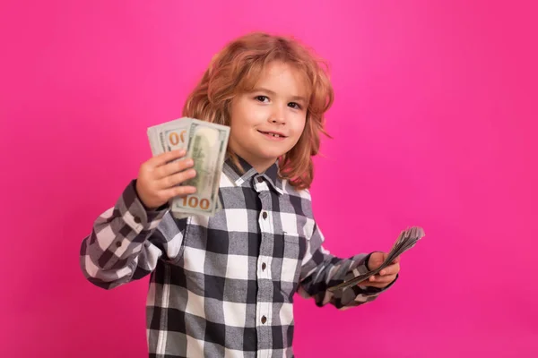 Rich child with dollars. Lottery cashback, win big money isolated pink red background