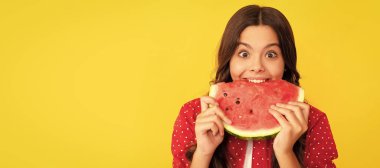 hungry kid with fruit. healthy food for children. fructose healthy eating on summer vacation. Summer girl portrait with watermelon, horizontal poster. Banner header with copy space