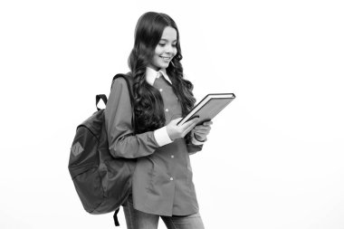 School girl teenager child with book and copybook. Teenager schoolgirl student with backpack, isolated background. Learning and knowledge education concept