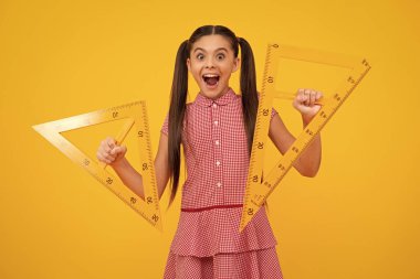 Amazed teenager. Back to school. Teenager school girl on isolated background. School supplies. Excited teen schoolgirl