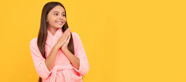 stock image happy teen girl in home terry bathrobe, joy. Child face, horizontal poster, teenager girl isolated portrait, banner with copy space