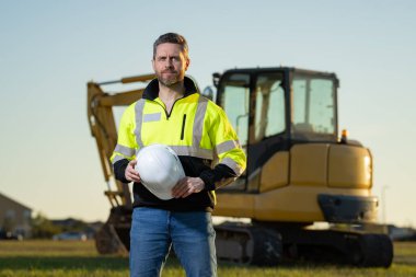 Worker with bulldozer on the building construction
